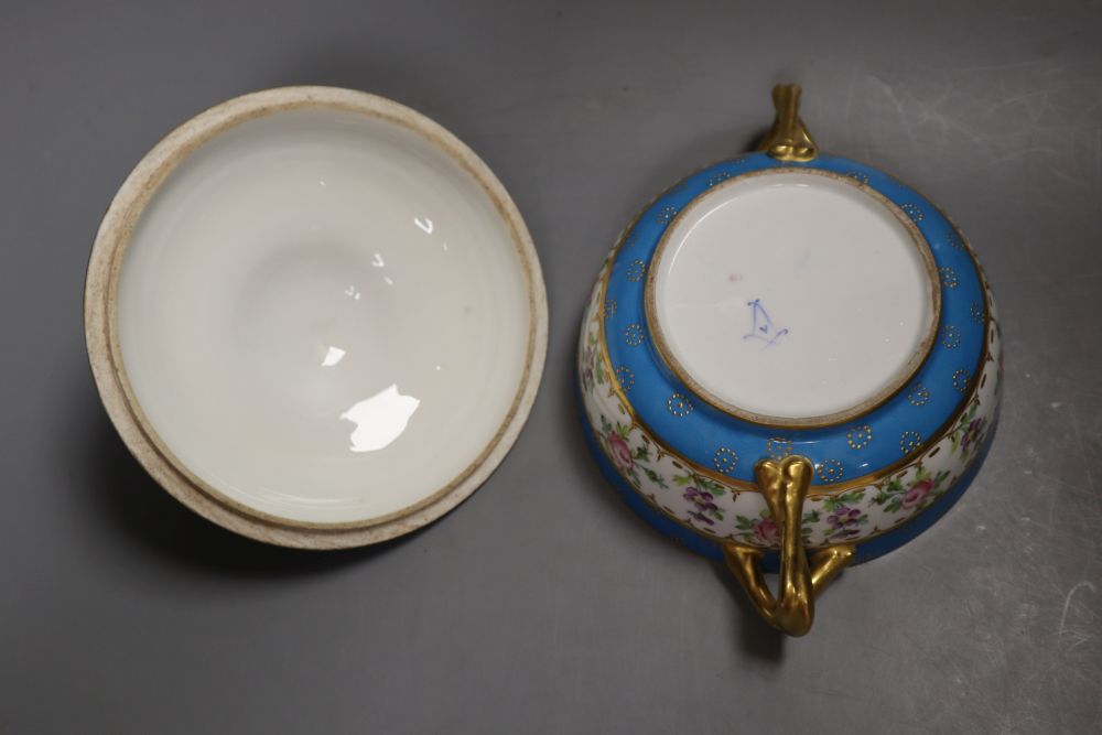 A 19th century Paris porcelain handled bowl and cover painted with roses under turquoise borders, width 19cm height 12cm